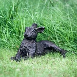 Lying Down Hare Bronze Sculpture -Sophie Allport Shop BSHALD01 Laying Down Bronze Hare Lifestyle Portrait High Res 2 web image