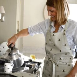 Bees Adult Apron -Sophie Allport Shop all36250 bees adult apron lifestyle high res square 9ae990d5 5e70 442b 9a2c 12b146abc5ba