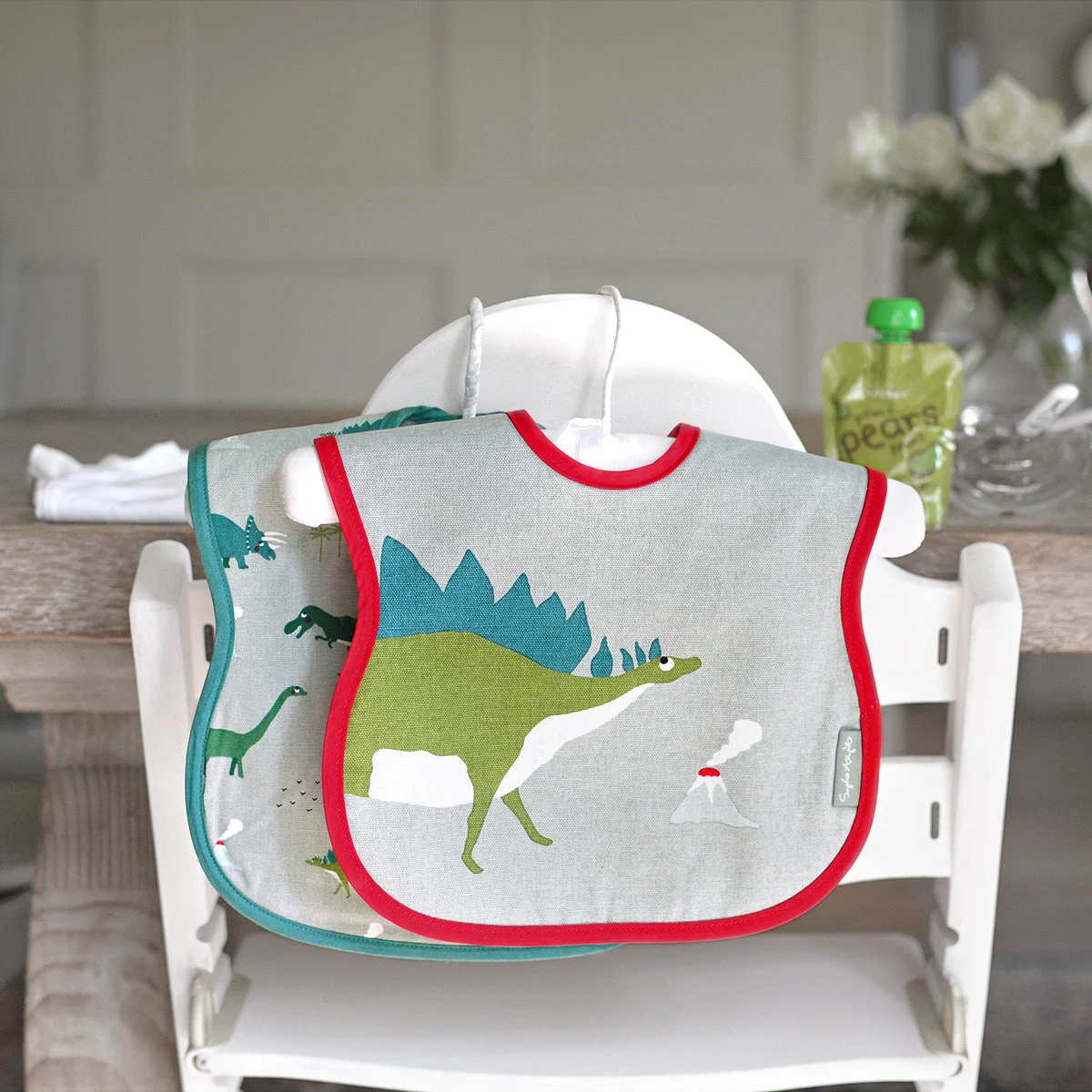 Dinosaur Bibs (Set of 2) Dinosaur Bibs (Set Of 2) -Sophie Allport Shop all45500s dinosaur statement child bibs set of 2 lifestyle high res square