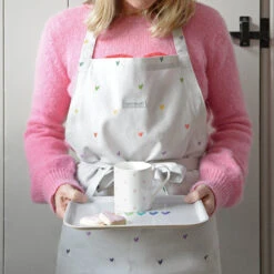 Multicoloured Hearts Adult Apron -Sophie Allport Shop all81250 pt8126 hearts multicoloured adult apron and small printed tray lifestyle high res square