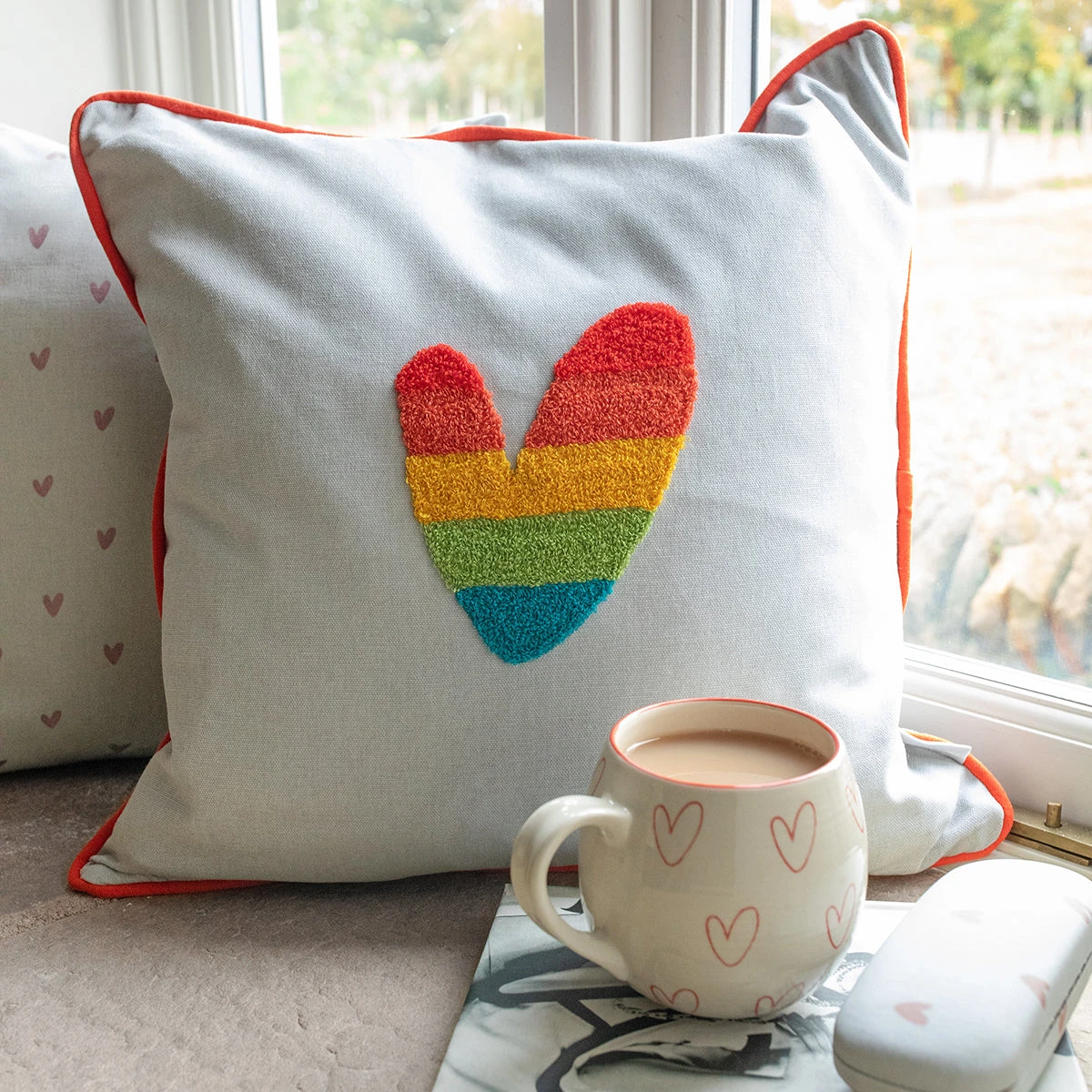 Multicoloured Hearts Embroidered Cushion Multicoloured Hearts Embroidered Cushion -Sophie Allport Shop all81401e spm81 hearts multicoloured embroidered cushion and stoneware mug lifestyle high res square