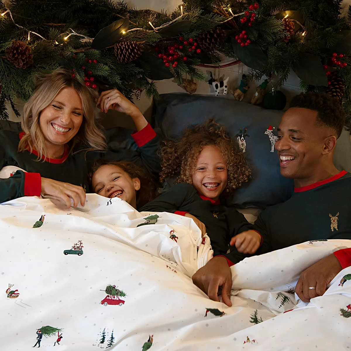 Christmas Dogs Kids Pyjamas Christmas Dogs Kids Pyjamas -Sophie Allport Shop christmas dogs family pyjamas modelled lifestyle high res square