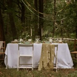 Hedgehogs Wool Knitted Throw -Sophie Allport Shop hedgehog and parkland trees table setting outdoors 2 lifestyle high res square