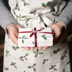 Holly & Berry Adult Apron -Sophie Allport Shop holly collection lifestyle web 2 c9bae037 ee96 49ea 80e1 a3b4ac155abc